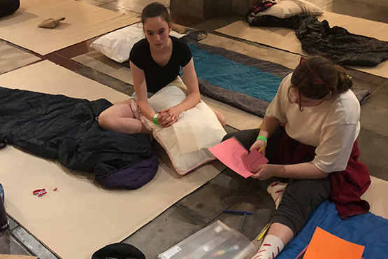 St Margaret's students prepare to sleep on cardboard on St John's Cathedral floor